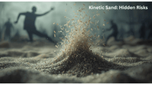 Dramatic close-up of coloured kinetic sand exploding upward in a cloud of particles and fibres, with two blurred child silhouettes playing in the background. Bold white text overlay in the upper right reads “Kinetic Sand: Hidden Risks”. Dark, moody grey-blue colour palette symbolising danger in sensory play materials affected by the 2025 asbestos recall.