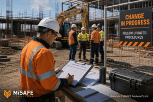 Australian site supervisor reviewing a Change Management Register at a construction site